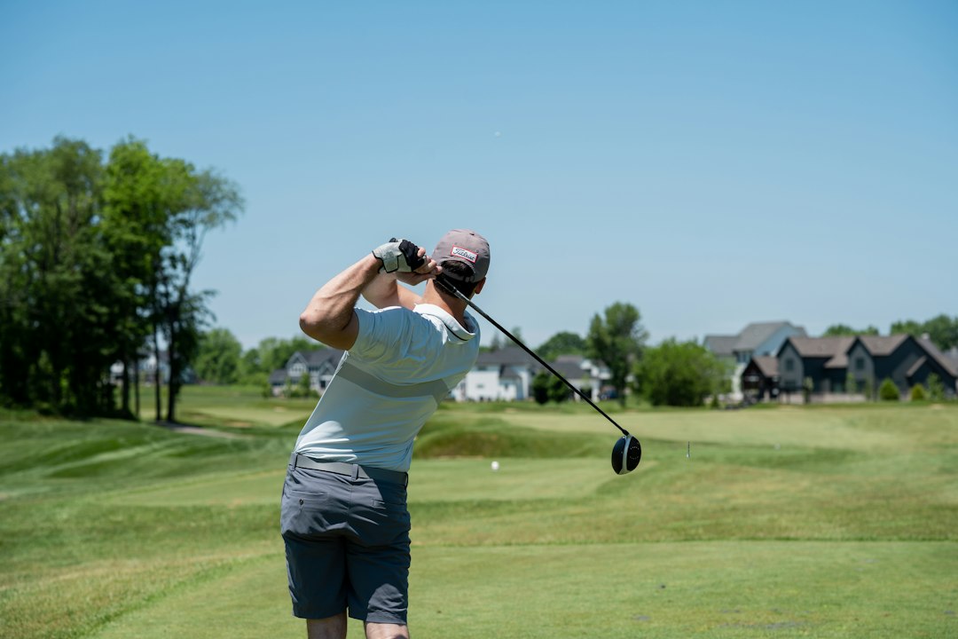 A golfer holding a driver during a round