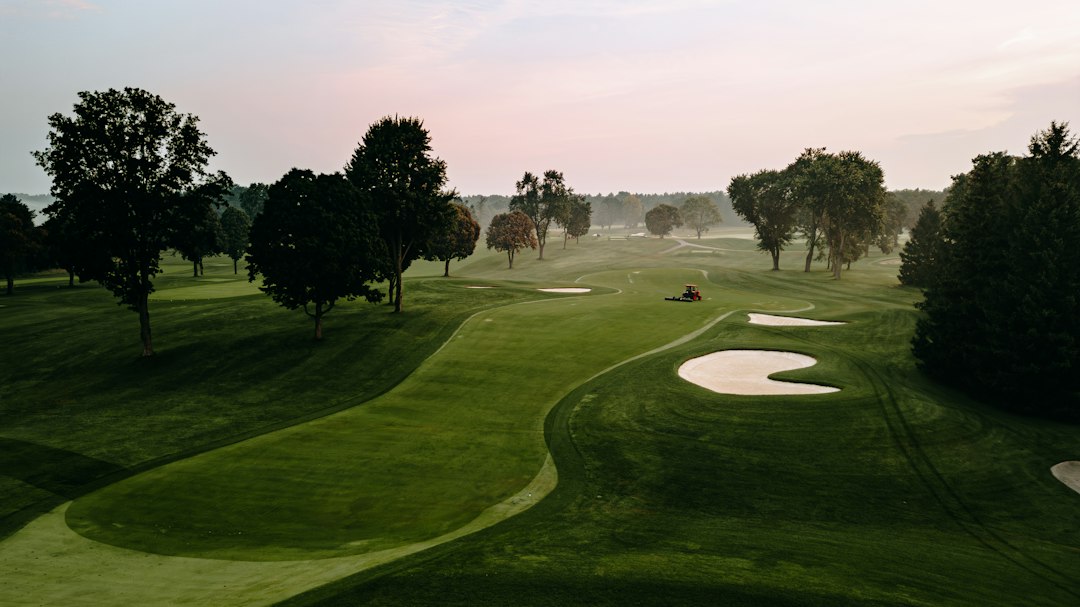 Early morning light over the fairway of a golf course