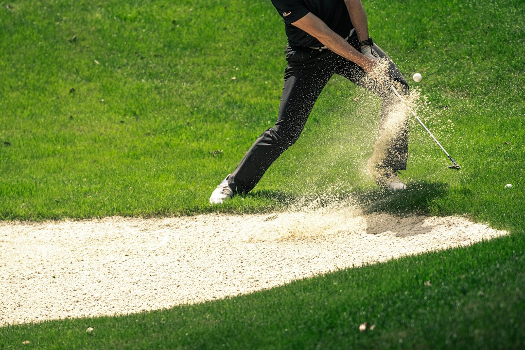 A golfer swinging a golf club